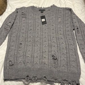 Grey crew neck distressed sweater size ladies Xl.